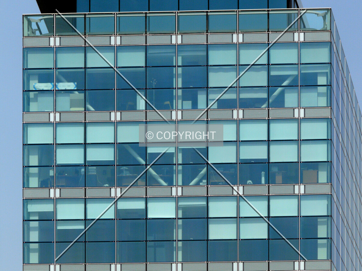 Diagonal steel beams visible through the curtain wall