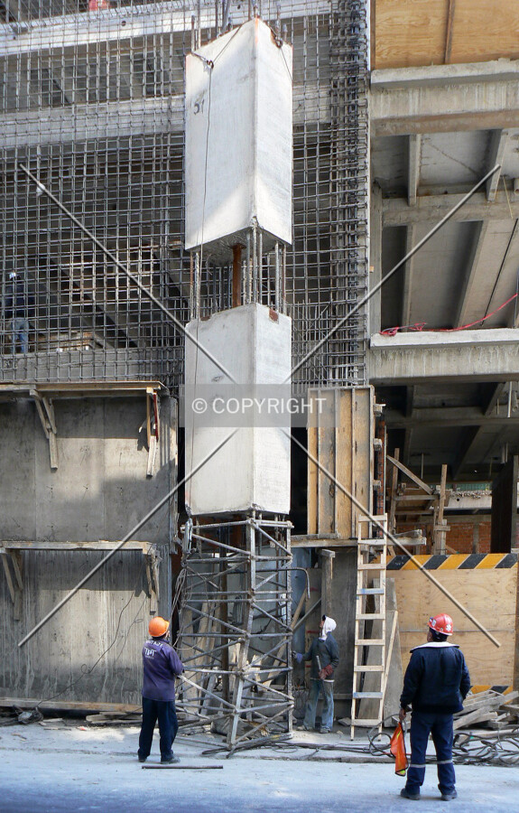 One of the prefabricated pilars getting up the building
