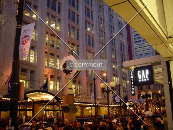 Friday night shoppers fill the sidewalks and streets