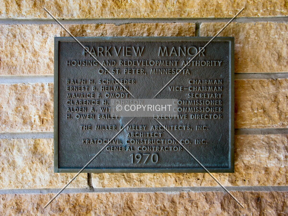 Dedication plaque at main entrance, with locally-quarried Kasota limestone