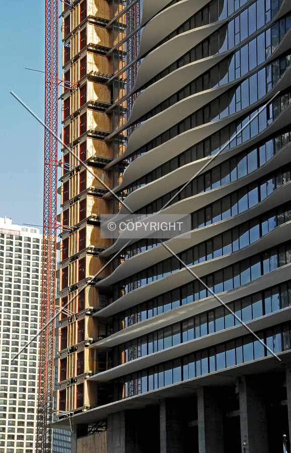 Construction skip and north facade viewed from the west