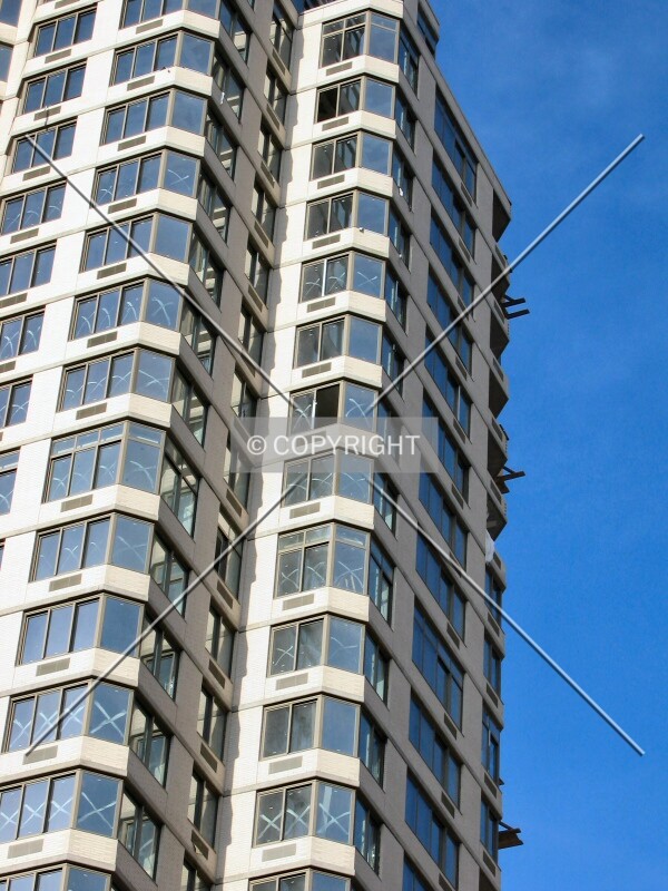 Construction materials hanging off unfinished balconies