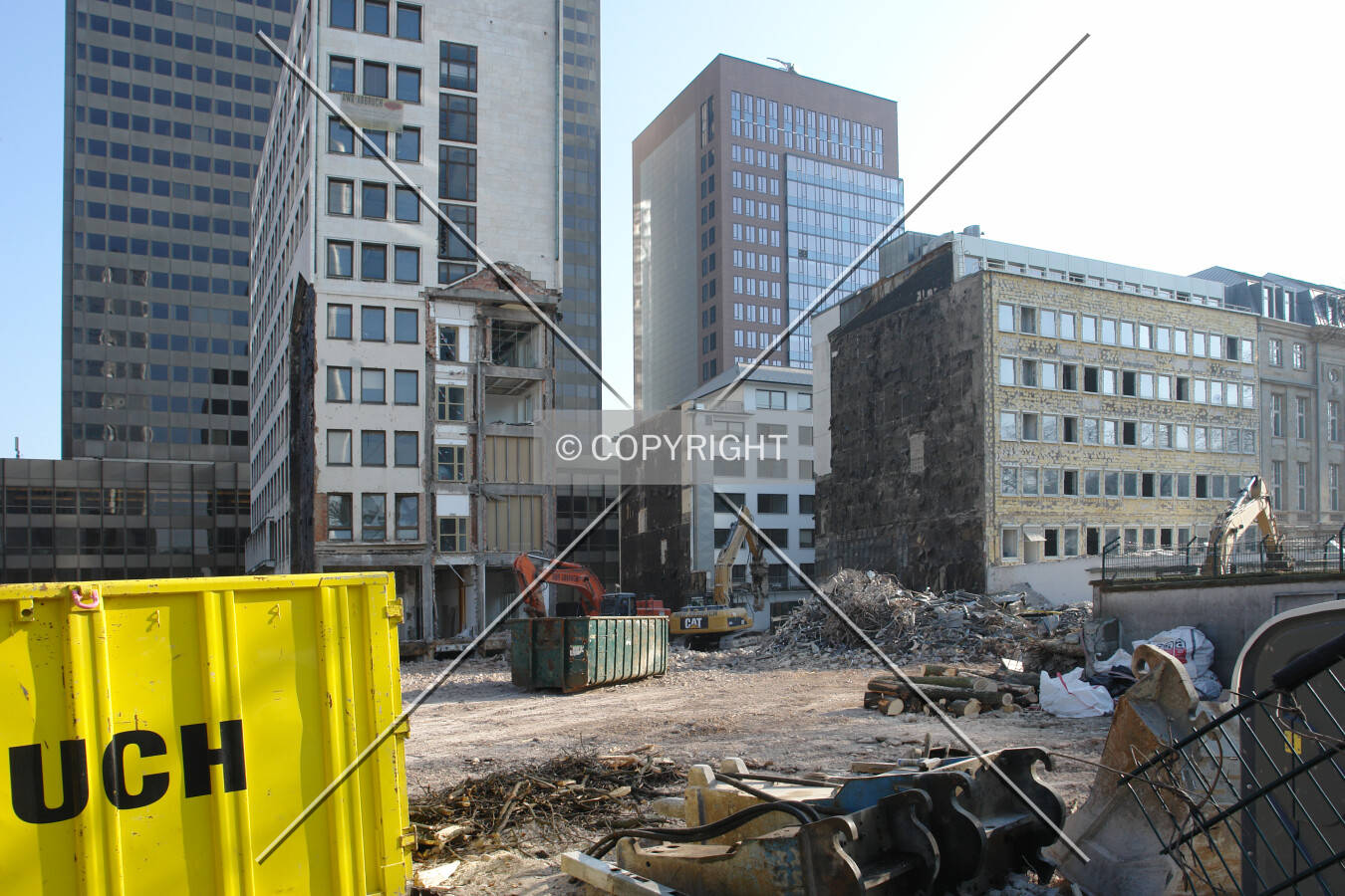 The construction site of the Taunusturm with existing buildings being under demolition