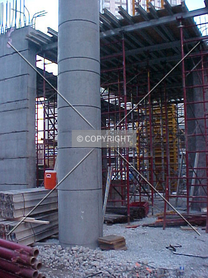 Looking into the site with a column and scaffolding in the background
