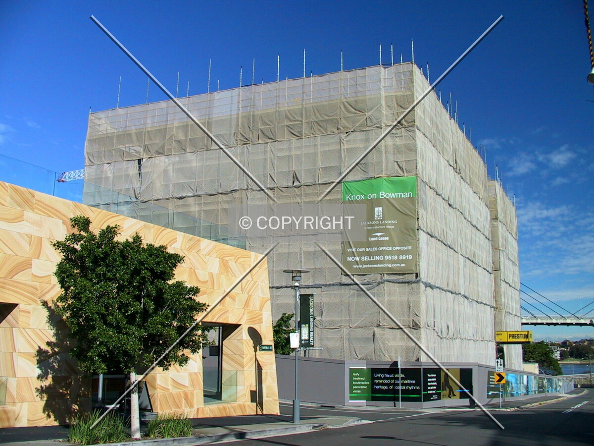 The smaller Knox Apartments adjacent to the larger Stonecutters tower