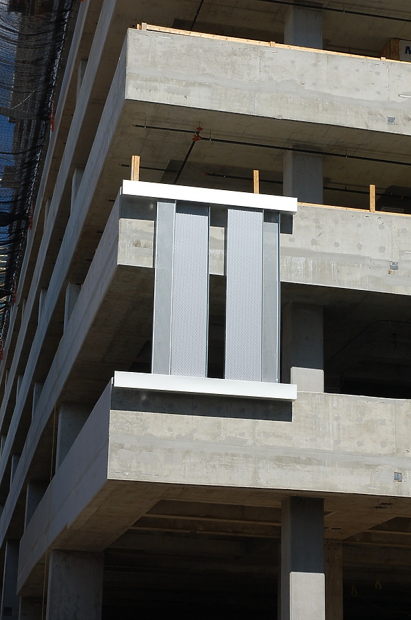 Facade portion covering the parking deck