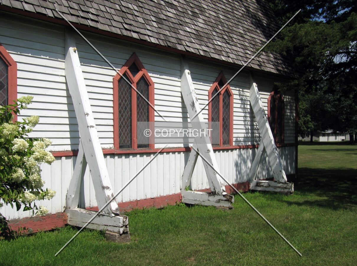 Detail of gothic windows and board-and-batten siding