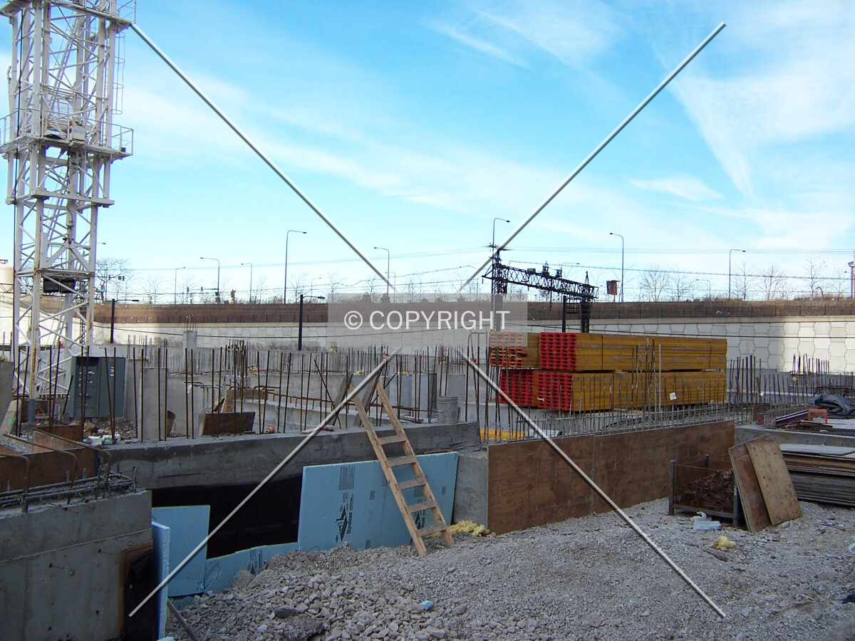Foundation work viewed from the south edge of the site on 13th Street