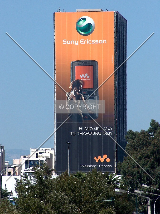 Unusual distant view depicting one of the huge advertisement signs occasionally covering the front side of the tower