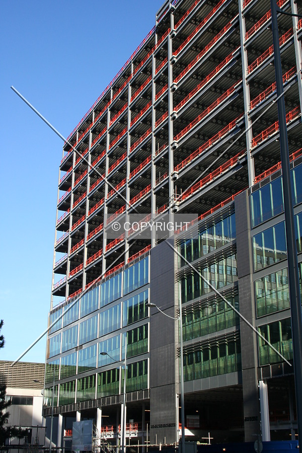 View from street level showing facade progress
