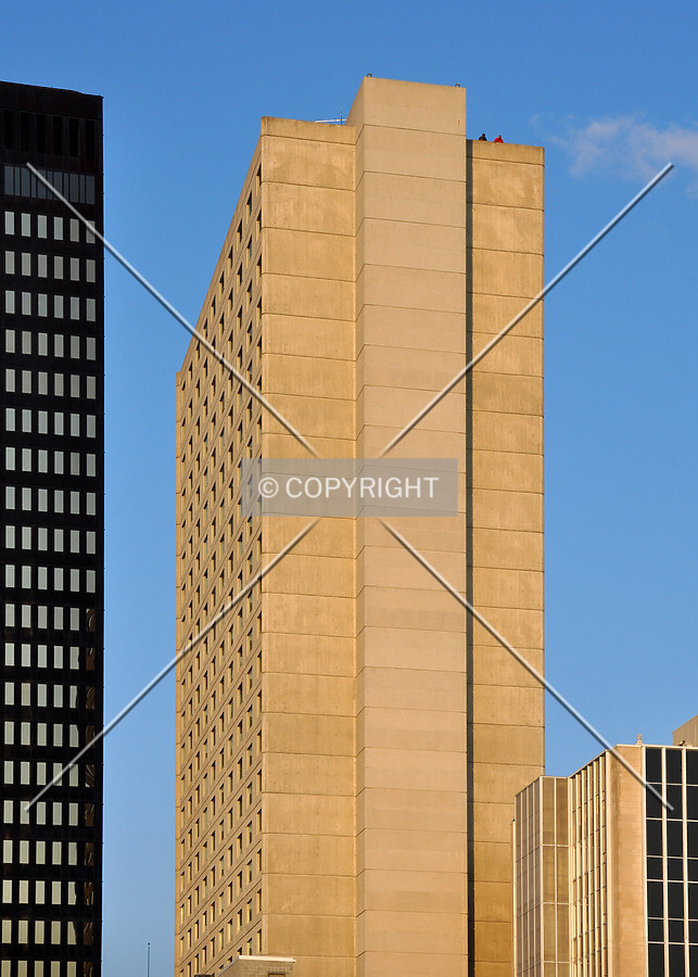 Distant view of upper floors from atop nearby parking ramp