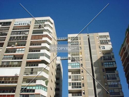 This building (left) is connected with a rooftop bridge