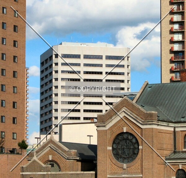 Distant view to the southeast over the St. Louis Catholic Church, flanked by the Pointe of St. Paul and City Walk