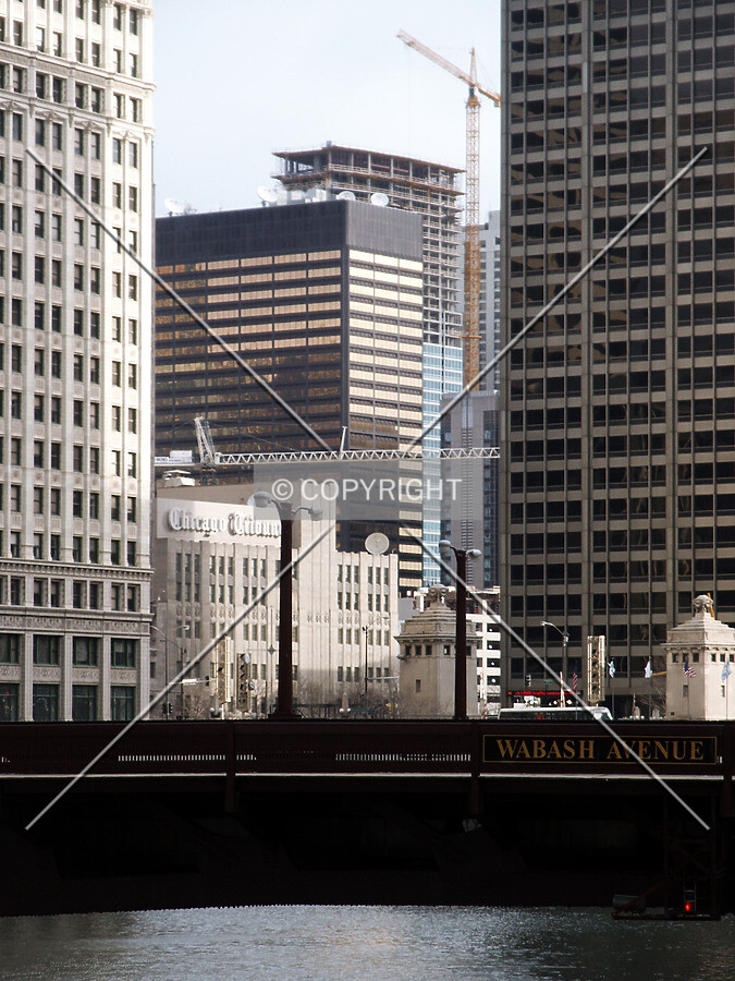 Behind the Time-Life Building as seen from the State Street bridge; the lower crane belongs to The Fairbanks