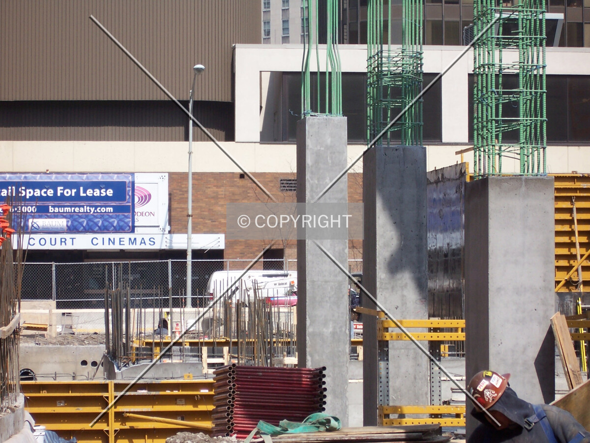 Looking north into the site. Elevator cores of the tower are begining to rise out of the ground in the background