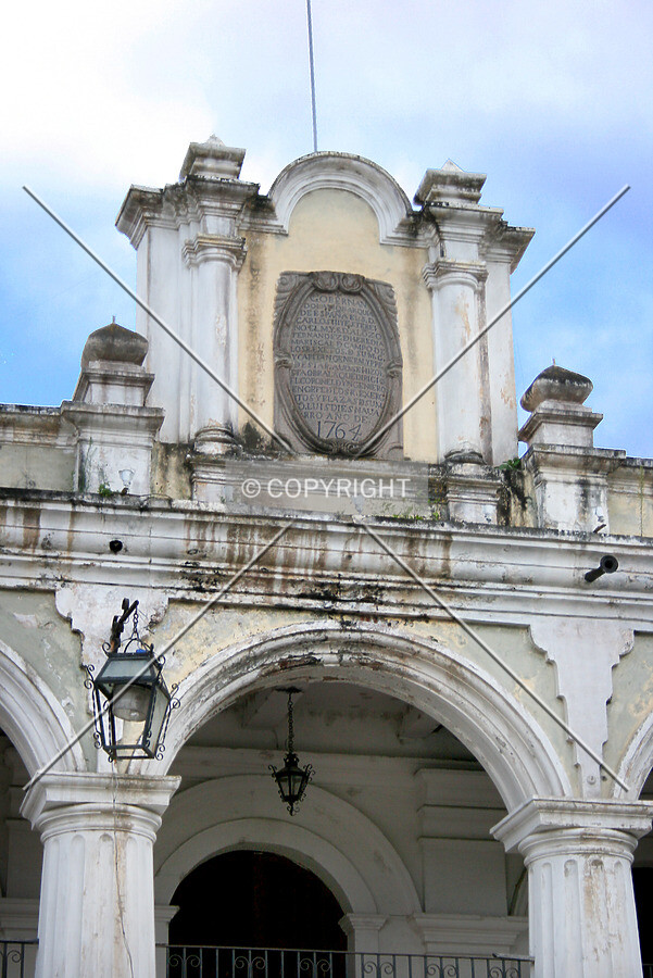 Plaque above entrance, east side
