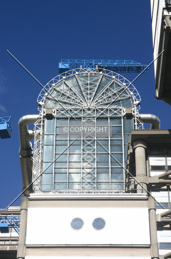 View north from Lime Street looking up at the top of the atrium flanked by a services tower at right