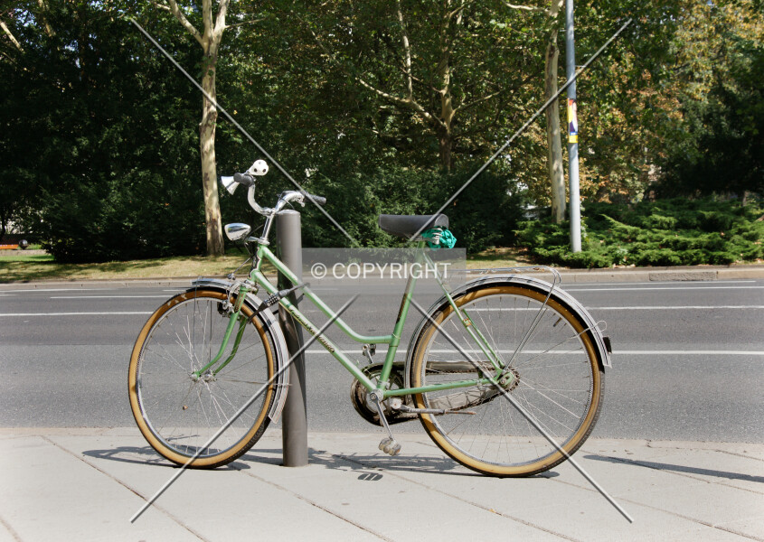 Bike standing at a pole