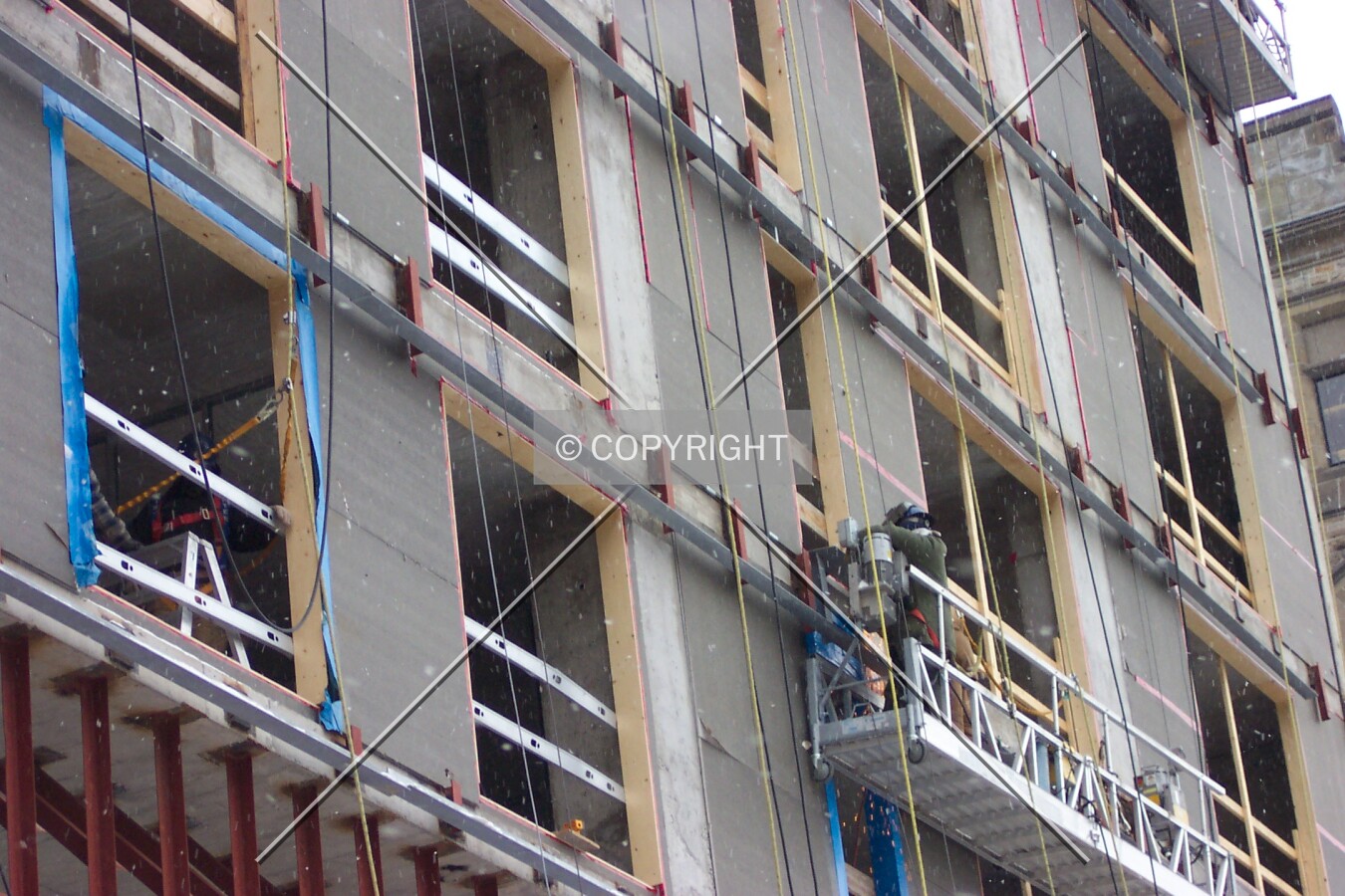 Window casings and exterior wall supports being installed