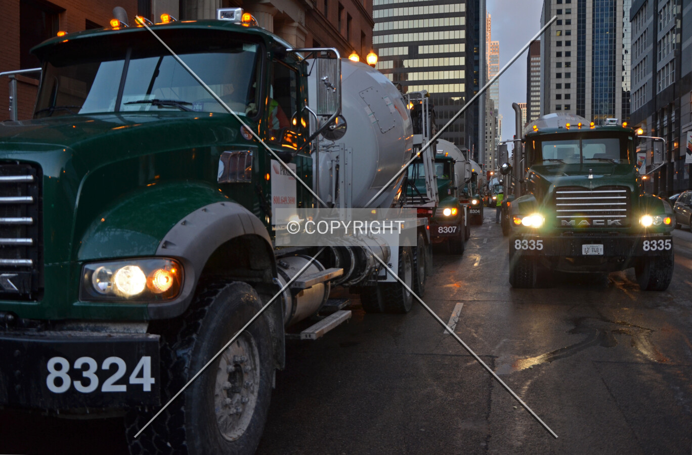 Concrete trucks queued along Randolph Street during the foundation mat pour on a very cold day; February 14, 2015.