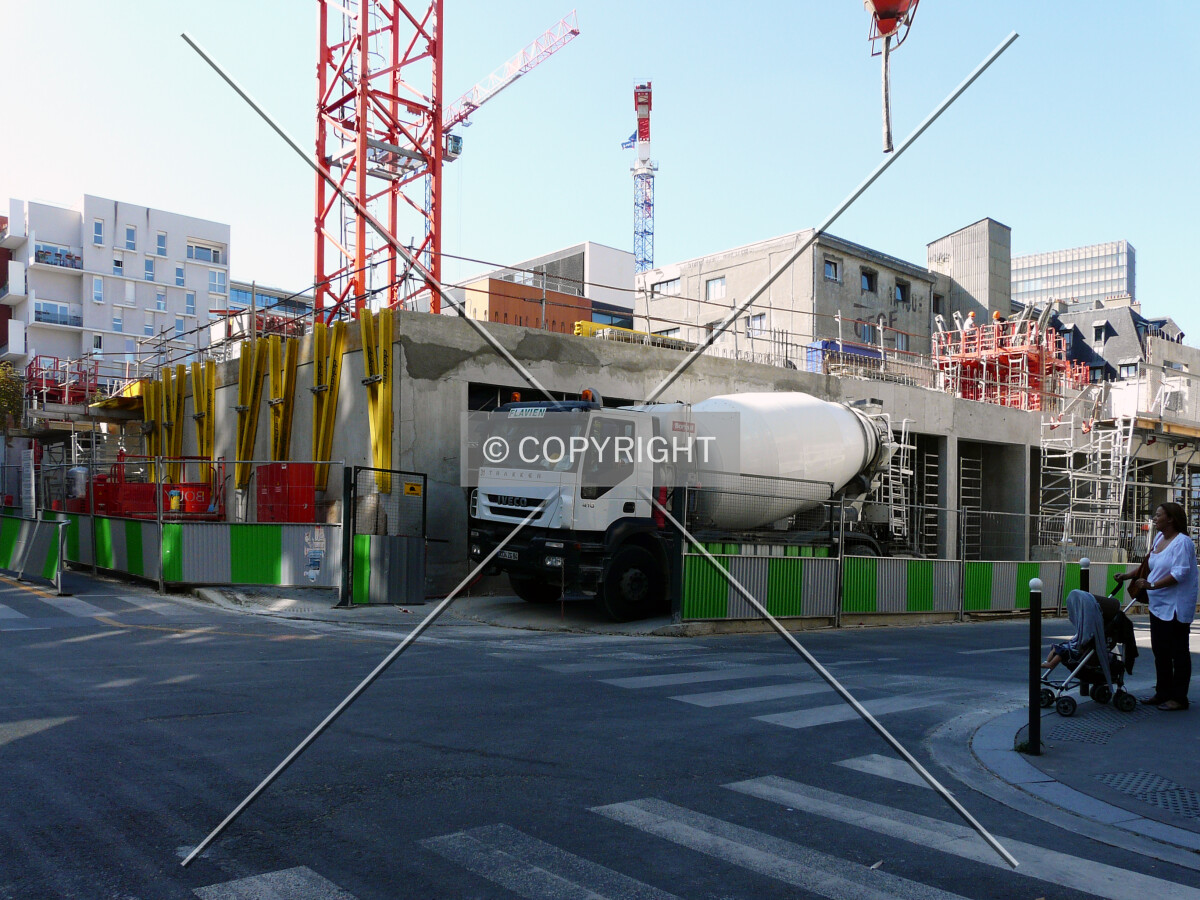 Truck delivering concrete at the east corner of the site