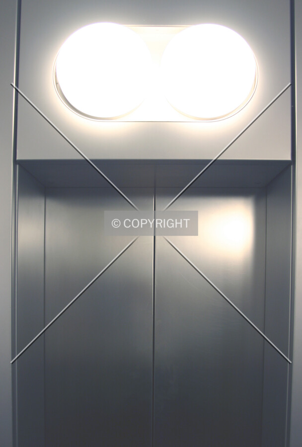 Lighting array above doors to the scenic lifts