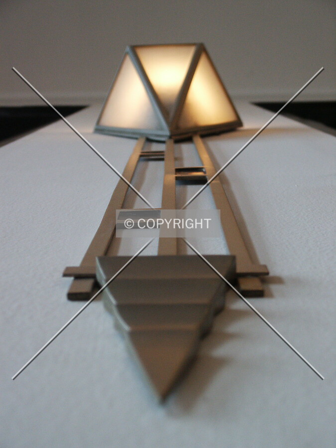 Looking up at one of the wall-mounted lights in the ballroom