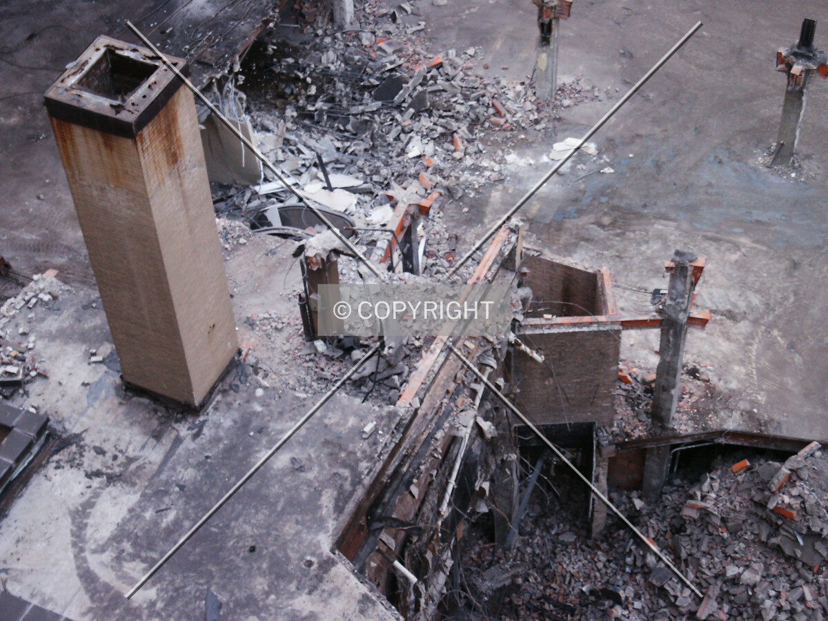 Chimney and cross-section of the building being torn down