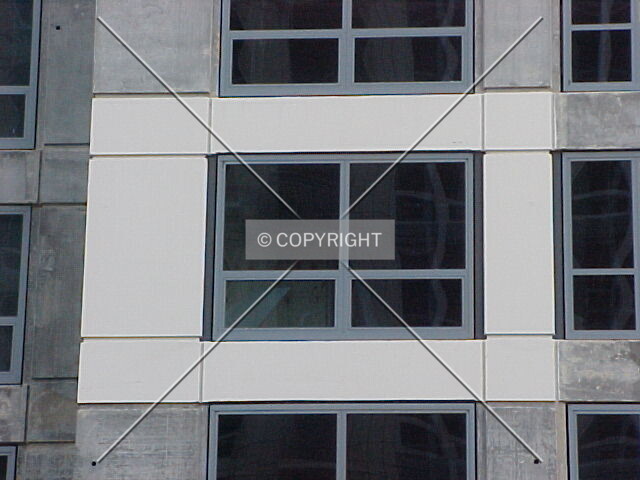 Partially painted facade and window detail