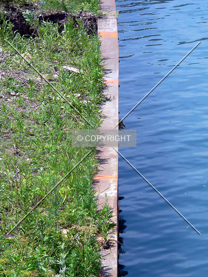 Settlement marks on the seawall along Ogden Slip