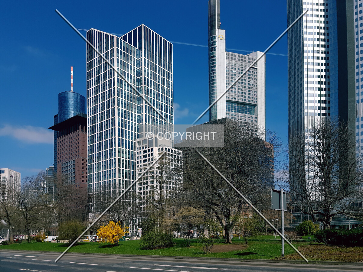The white TaunusTurm next to other Frankfurt skyscrapers