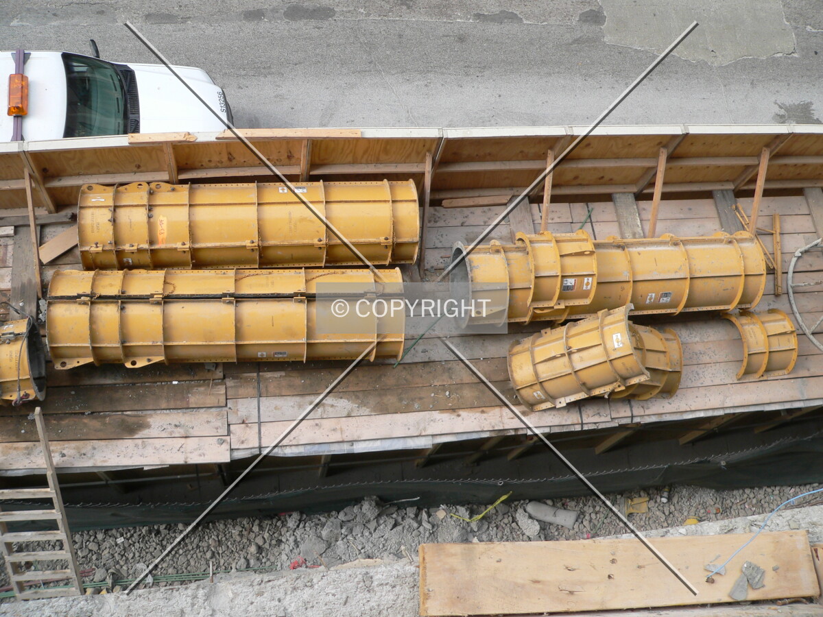 Formwork being stored on top of the protective barricade