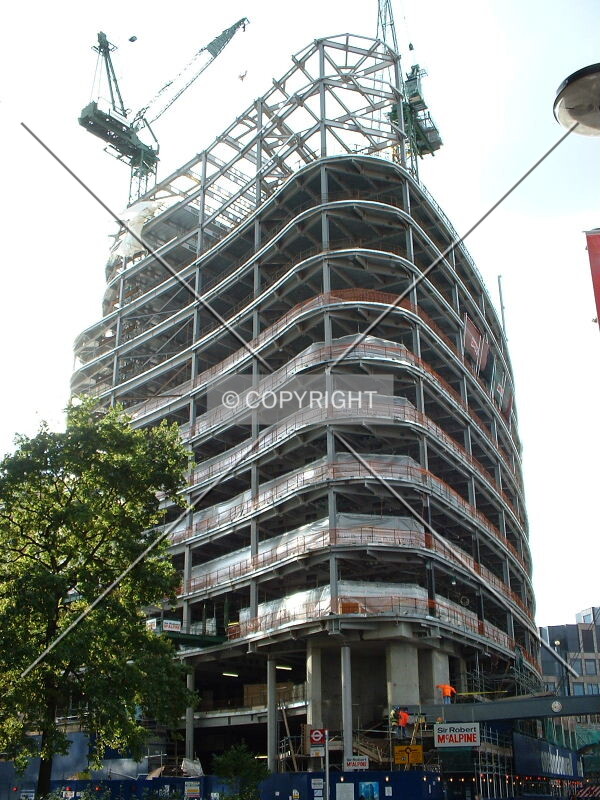 Construction continues with the frame reaching full height