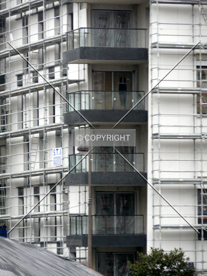 Lower floors on the south corner, with balcony railings installed