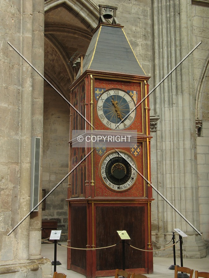 Famous astronomical clock located at the entrance of the south side of the nave