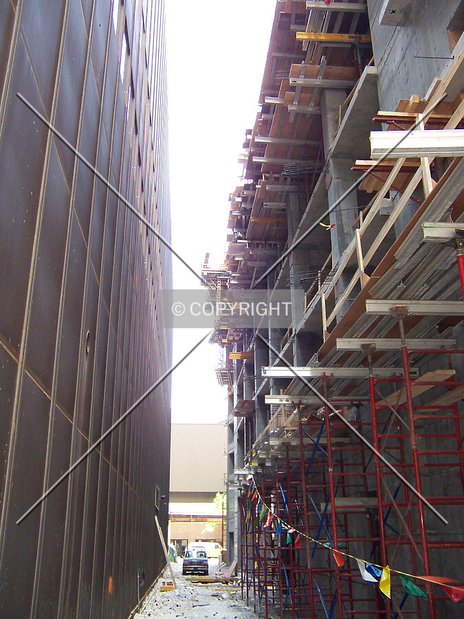 Looking north through the gap between the base's western wall and the neighboring Time Life Building