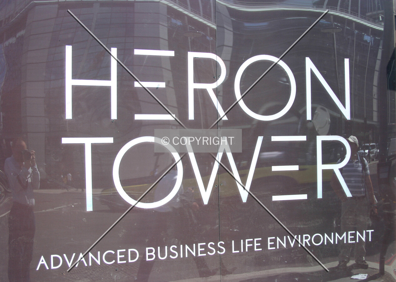 View east of the site hoarding and logo from Bishopsgate