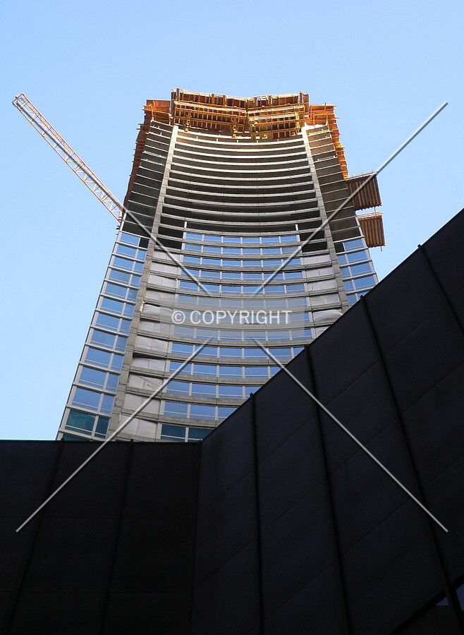 The western face of the structure rising above the lowrise portion of the Time Life Building