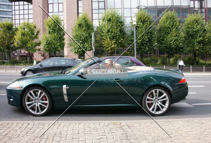 A green Jaguar convertible