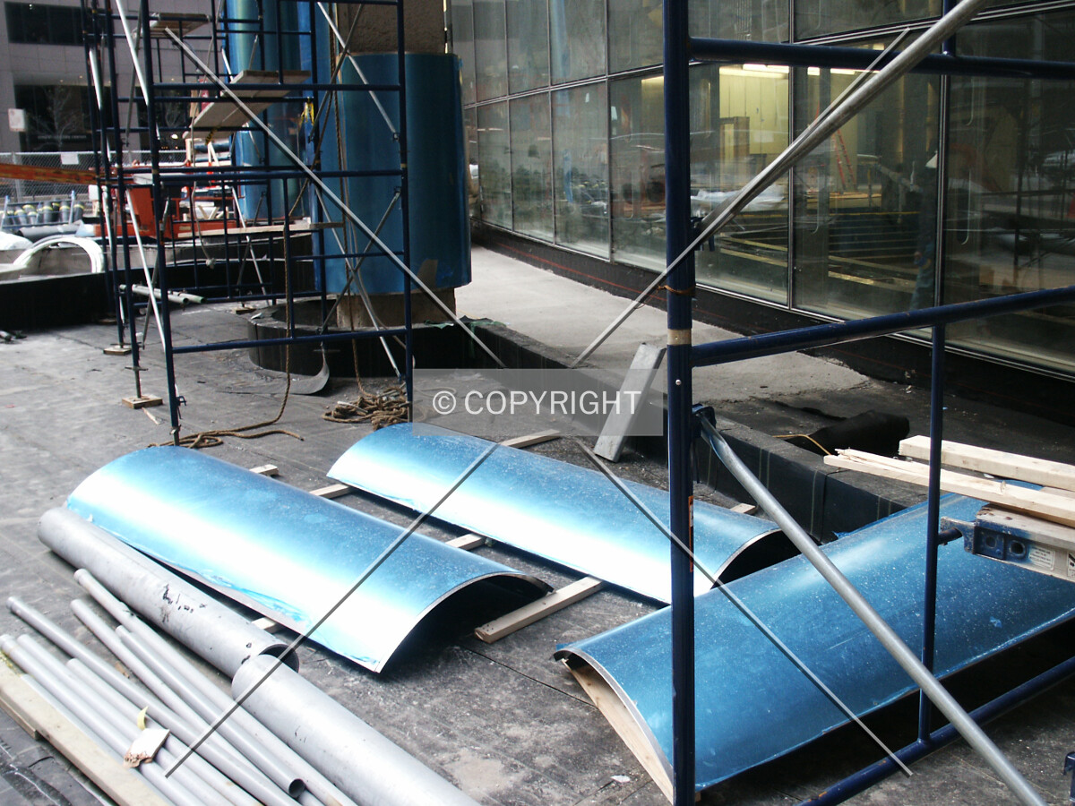 Sections of column cladding with blue protective film