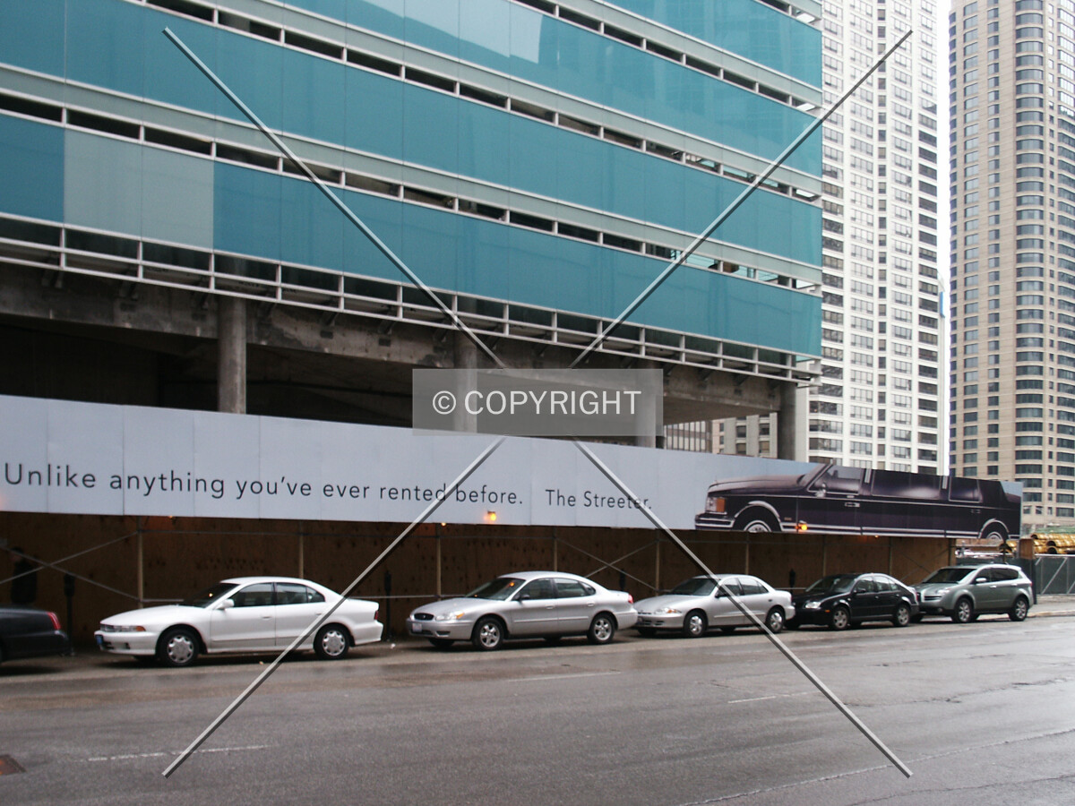 Slogan and limousine over the walkway on Grand Avenue
