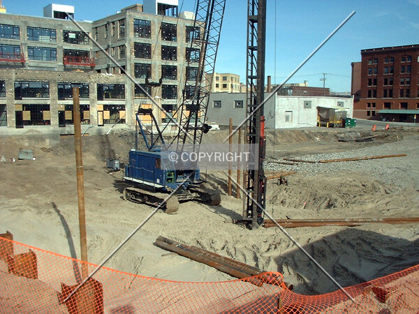 Drilling caissons, from 6th Avenue/4th Street North