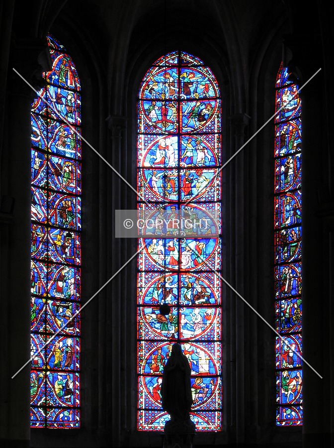 Stained glass windows of the radial chapel dedicated to Our Lady of Lourdes