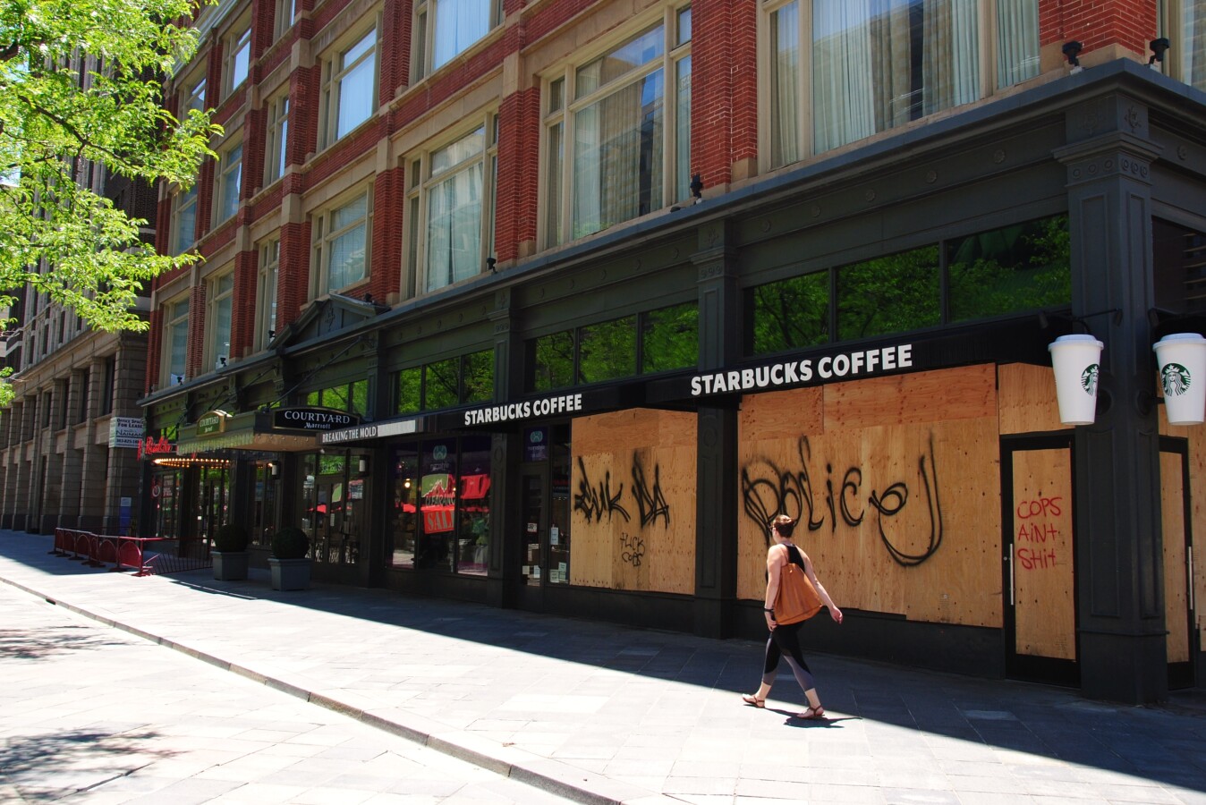 Windows boarded up after a protest got out of control