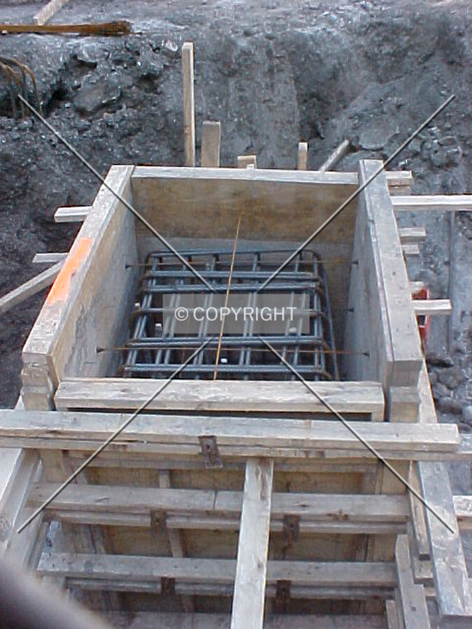 Rebar and formwork placement atop a caisson