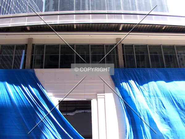 Door frame peeking out from tarpaulin