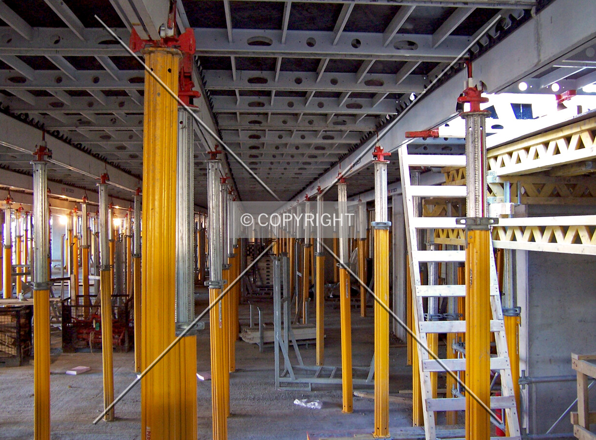 Looking into the parking garage structure from the intermediate level of Wacker Drive. Pole shores and temporary decking are in place until the concrete cures