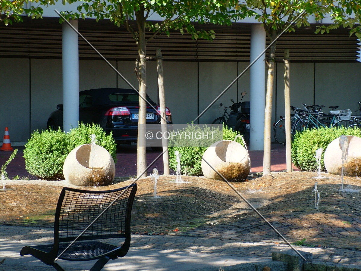 Fountain, sitting area and reserved car park