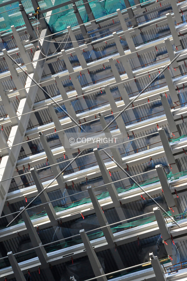 Cantilevered steel beams for attaching the exterior facade on the south side