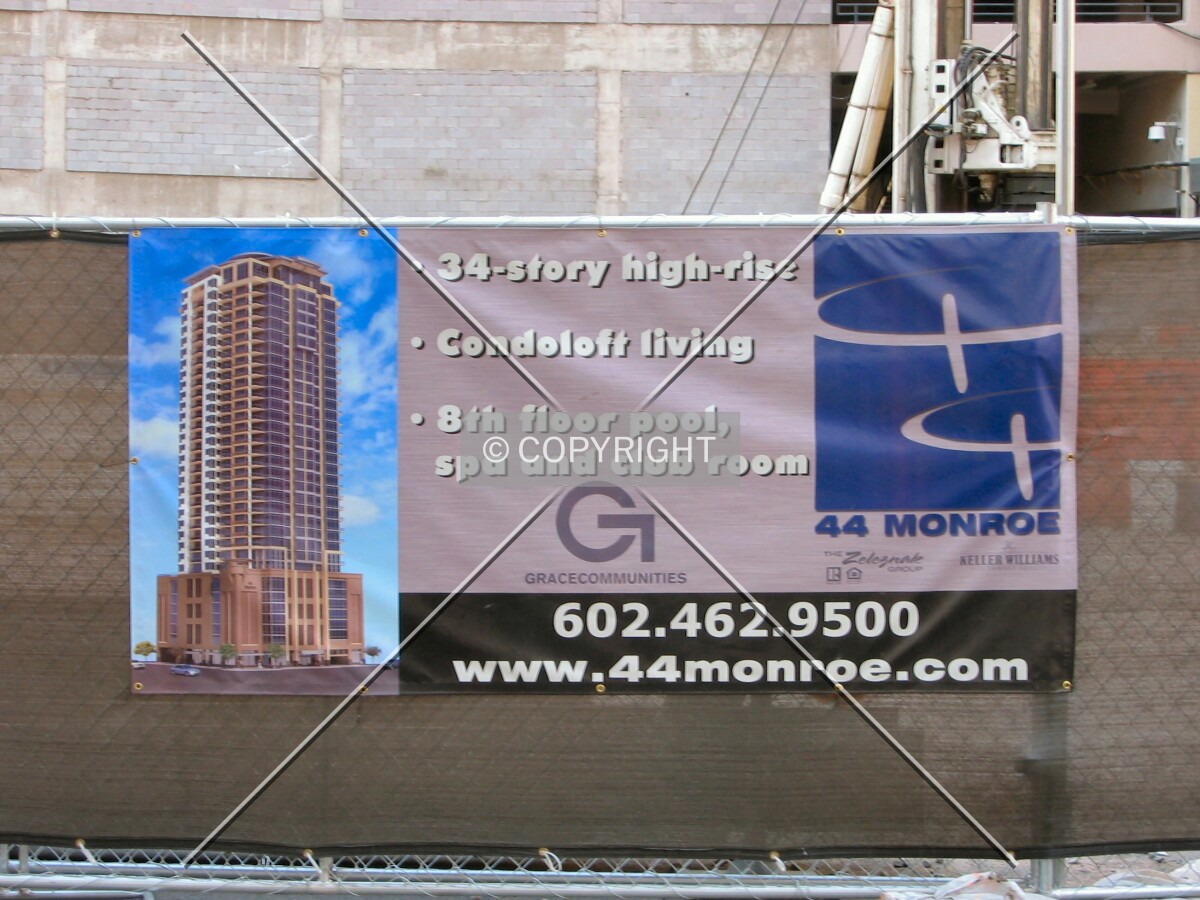 Project banner on Monroe Street barricade